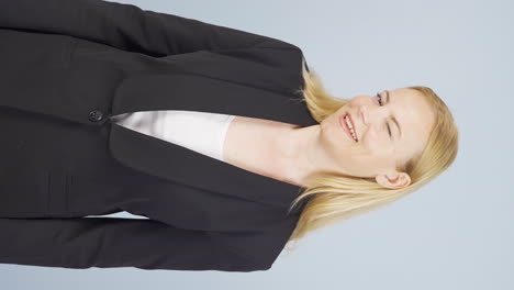 Vertical-video-of-Business-woman-winking-at-camera.